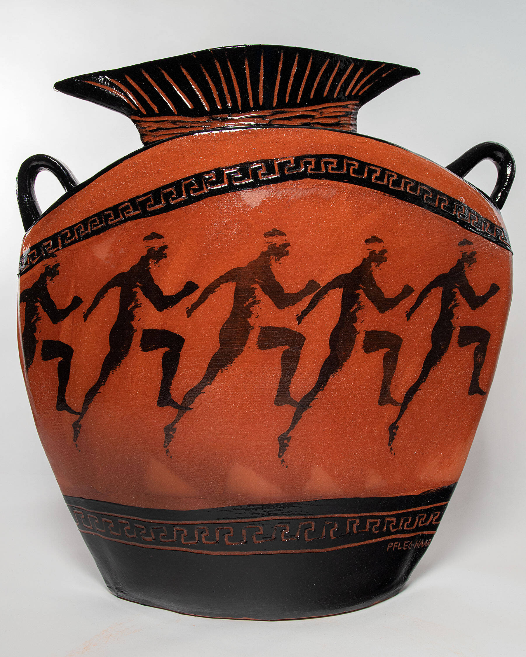 Ceramic terra cotta Greek-style vessel with a silk screen running man imagery.
